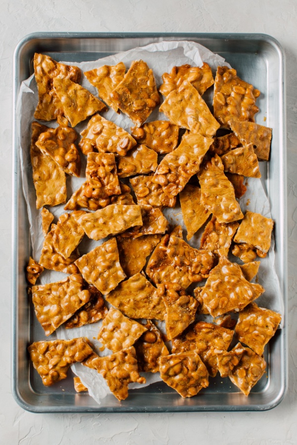 tray of broken pieces of peanut brittle