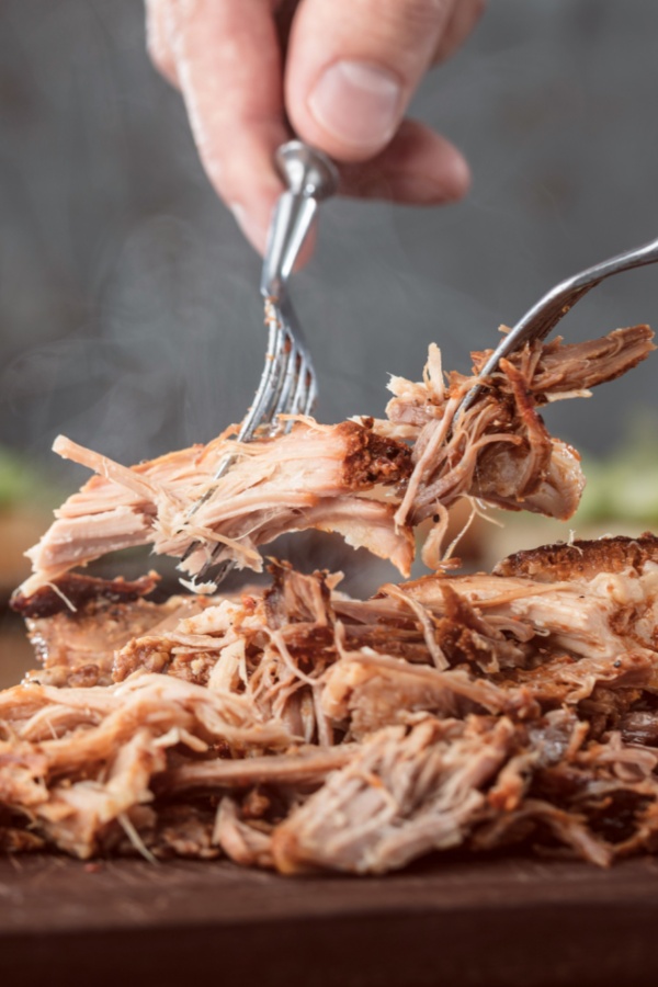 shredding pork with two forks