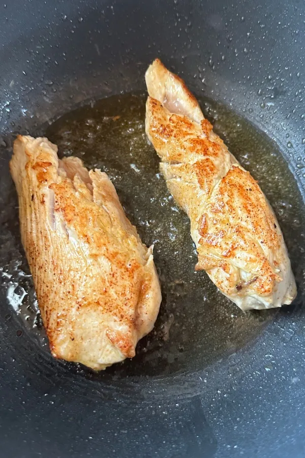 chicken cutlets in skillet