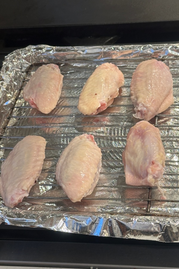 raw wings on baking rack