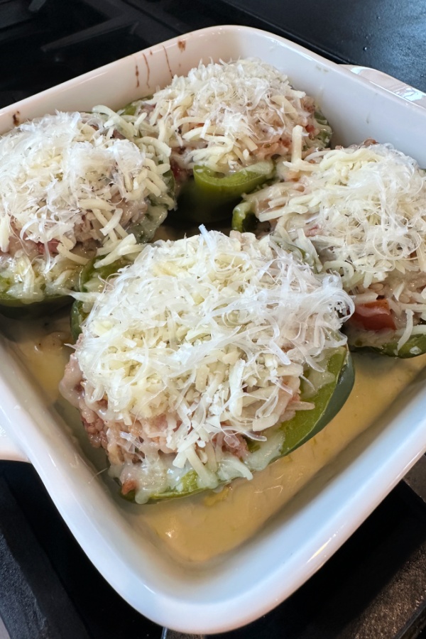 Parmesan cheese on top of stuffed peppers