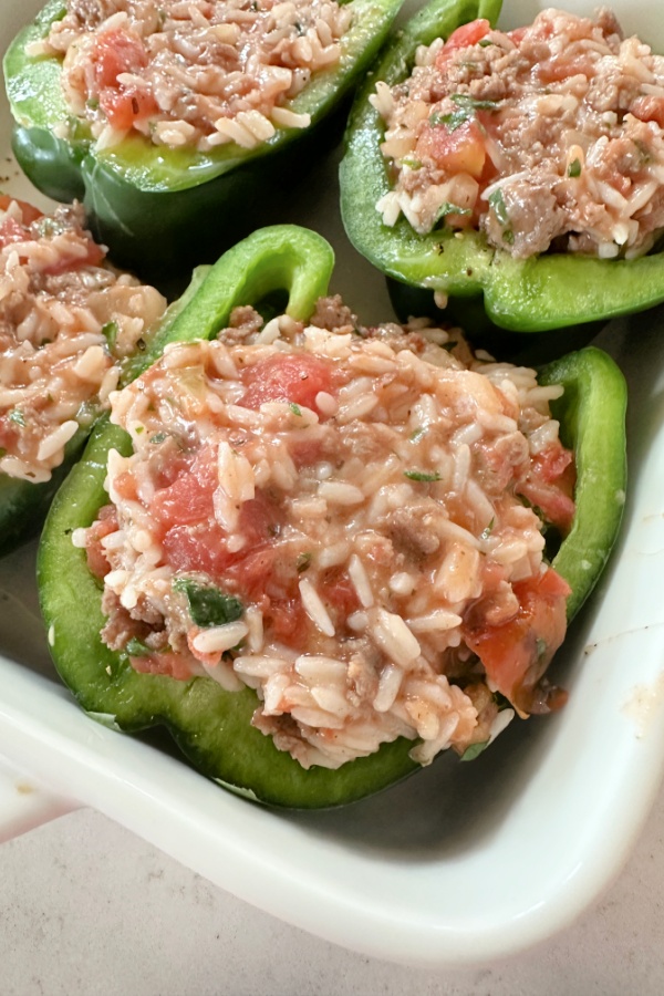 half of green pepper filled with ground beef and rice 