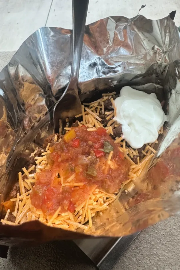 walking taco in a bag with sour cream