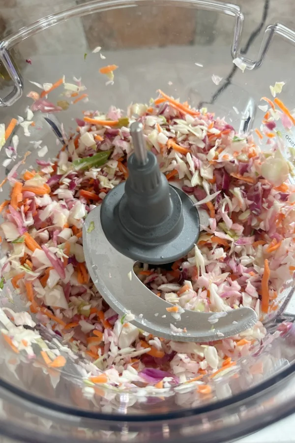 shredding cabbage and carrots