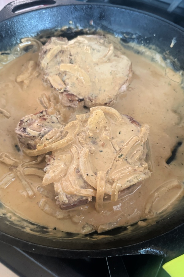smothered ranch pork chops in skillet