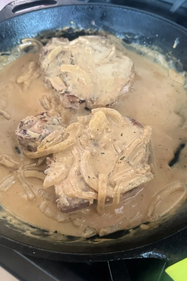 smothered ranch pork chops in skillet
